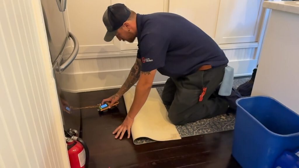 CJ performing moisture readings in Pasadena Home